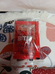 2 BAGS- BLOODY BITES GLOW IN THE DARK PLASTIC VAMPIRE FANGS OOZING BLOOD CANDY!!