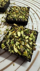 8 Dark Chocolate square Dubai filling & Pistachios on top handmade 520g.