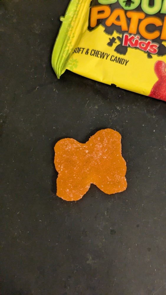 Orange flavored Orange conjoined sour patch kid
